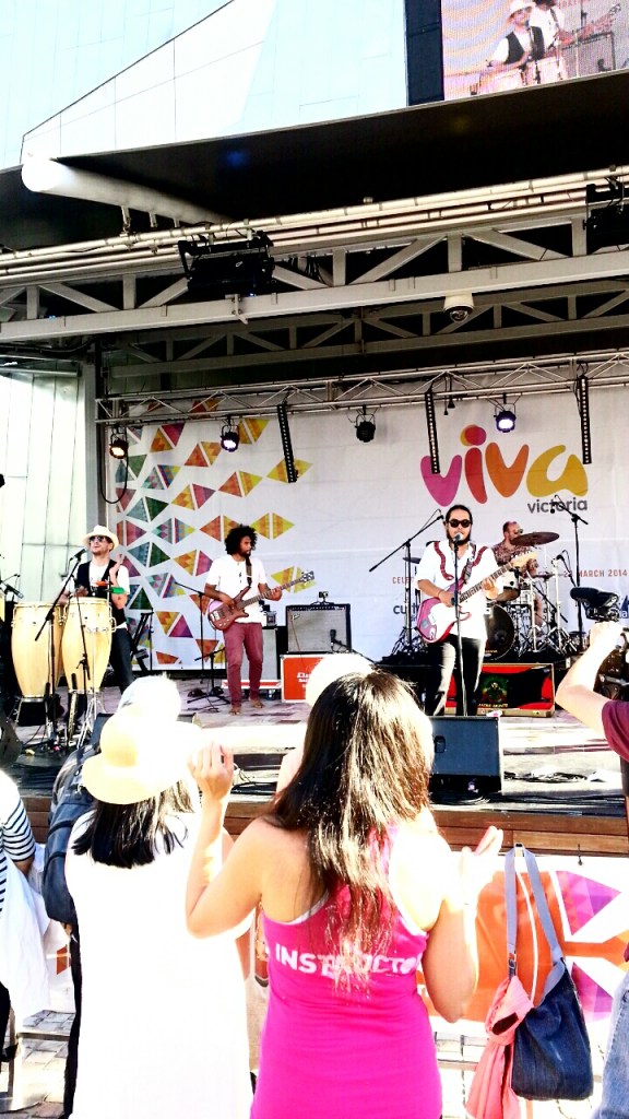 Multicultural crowd watching a band at the Viva Victoria Festival
