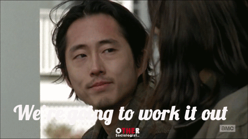 Glenn smiles at Maggie who is comforting him