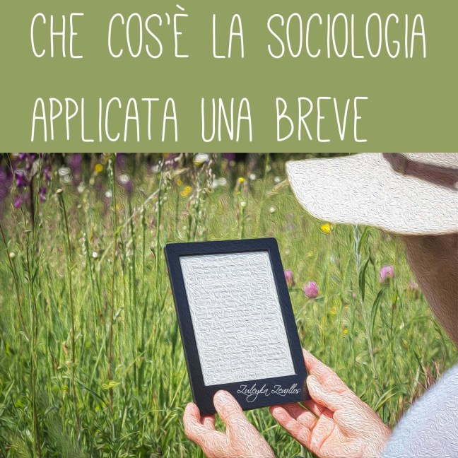 A White person is seen from behind, mostly out of frame. They sit in a field reading an eBook